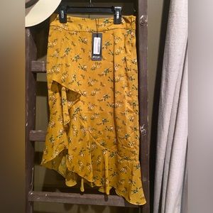 Floral Ruffle Midi Skirt in mustard. NWT and made by Nasty Gal. Size 2
